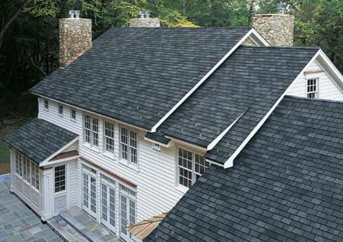 Vita Roofing project — finished dark asphalt shingle roof on a two-story home